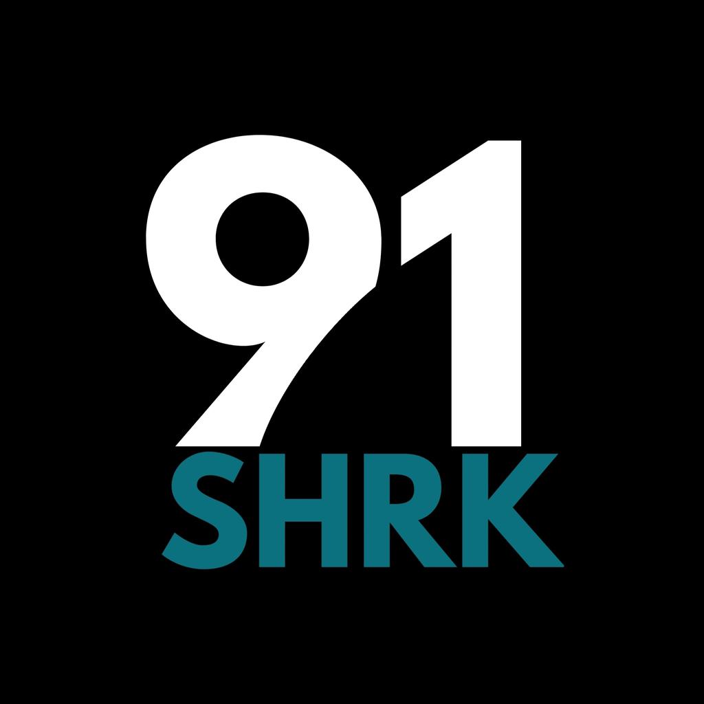 91 SHRK: SHARK CITY RADIO logo